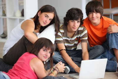 Early high school kids looking at computer