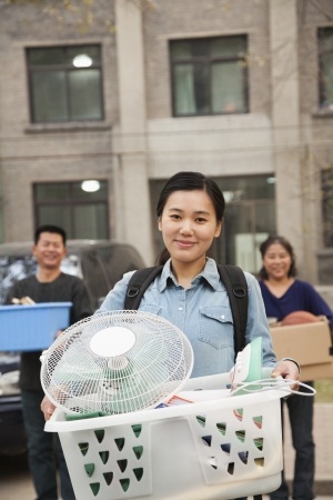 35987835 - student portrait in front of dormitory at college with family